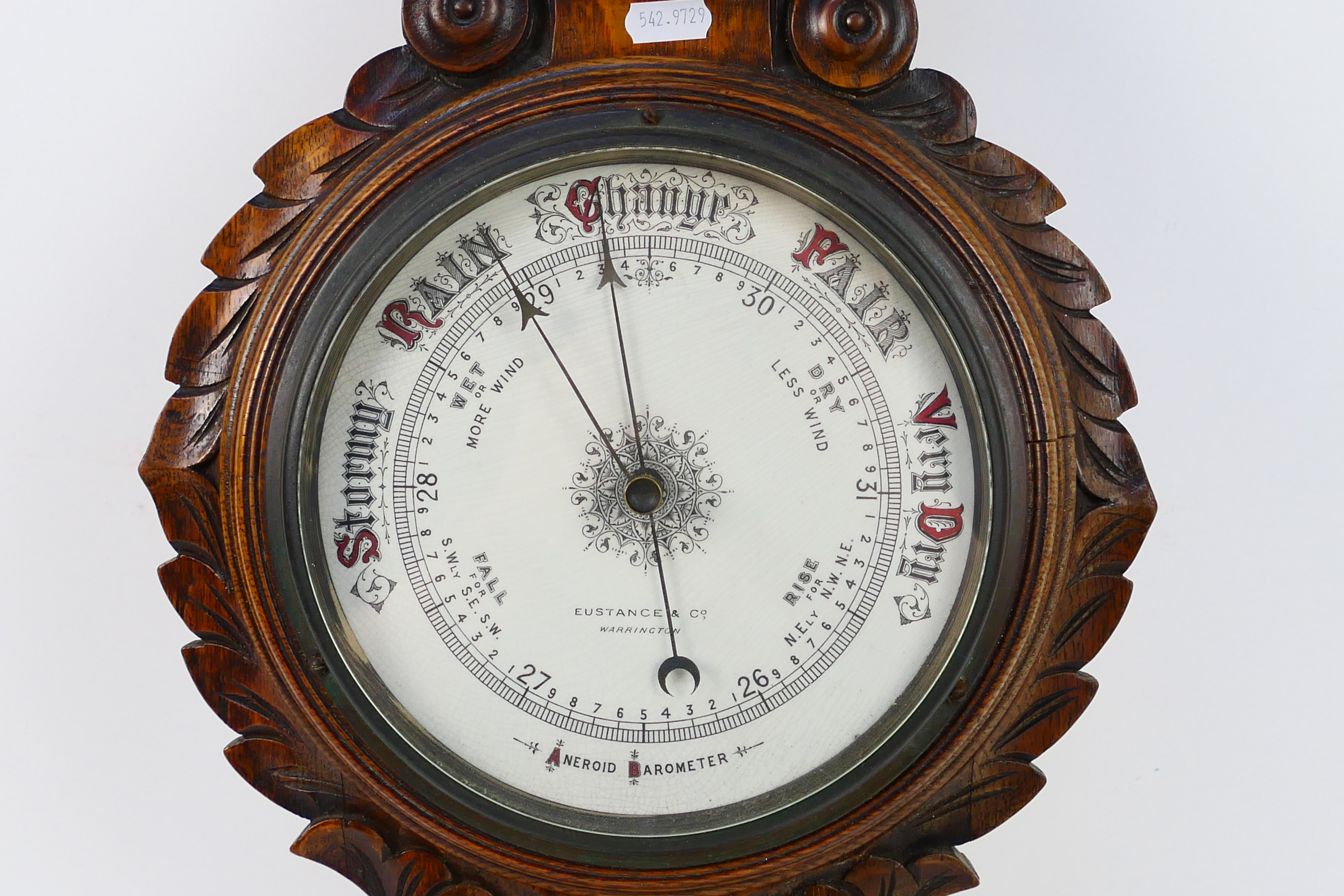 An oak cased aneroid barometer with carved decoration, marked to the dial Eustance & Co Warrington, - Image 5 of 5