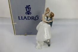 A boxed Lladro figure group # 8029 The Happiest Day depicting a bride and groom,