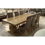 A good quality oak extending dining table and six chairs,