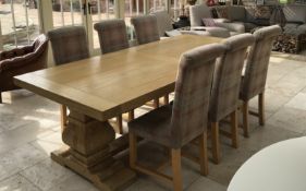 A good quality oak extending dining table and six chairs,