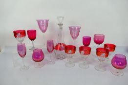 Cranberry Glass - a lidded decanter and five drinking glasses decorated with grape vines,