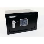 A small Yale safe with key.