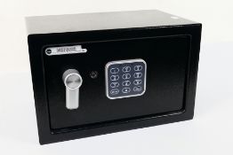 A small Yale safe with key.