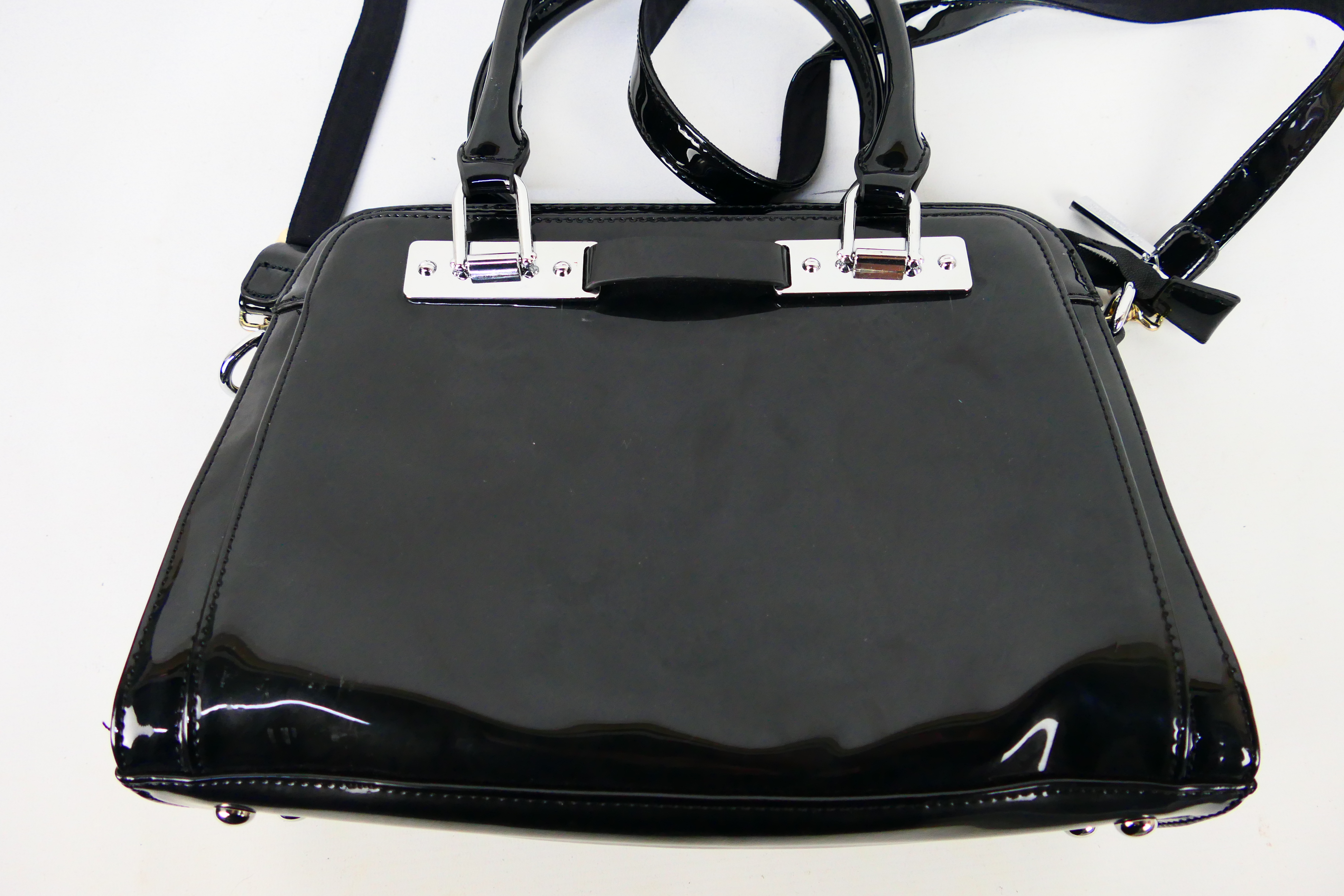 Superbia - A glossy black Superbia handbag with shoulder strap - Handbag has two inside zip pockets, - Image 2 of 4