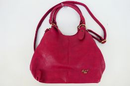 Mabel - A dark pink/purple Mabel London leather hand bag with shoulder strap - Handbag has one