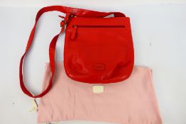 Radley - A limited edition Radley London orange leather handbag - Handbag has one interior zip