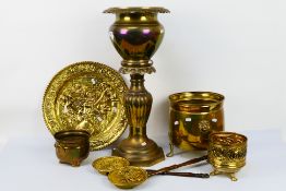 A collection of brassware to include jardiniere, charger and other. [2].