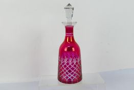 Cranberry Glass - a 19th century decanter, cut to clear with fitted stopper,