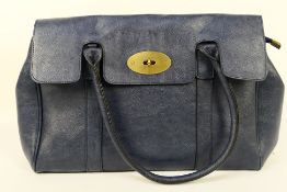 Guang Tong - A dark blue leather handbag with shoulder strap - Bag has two inner zip pockets and
