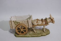 Royal Dux - A ceramic study depicting a donkey and cart, # 921, approximately 28 cm (l).