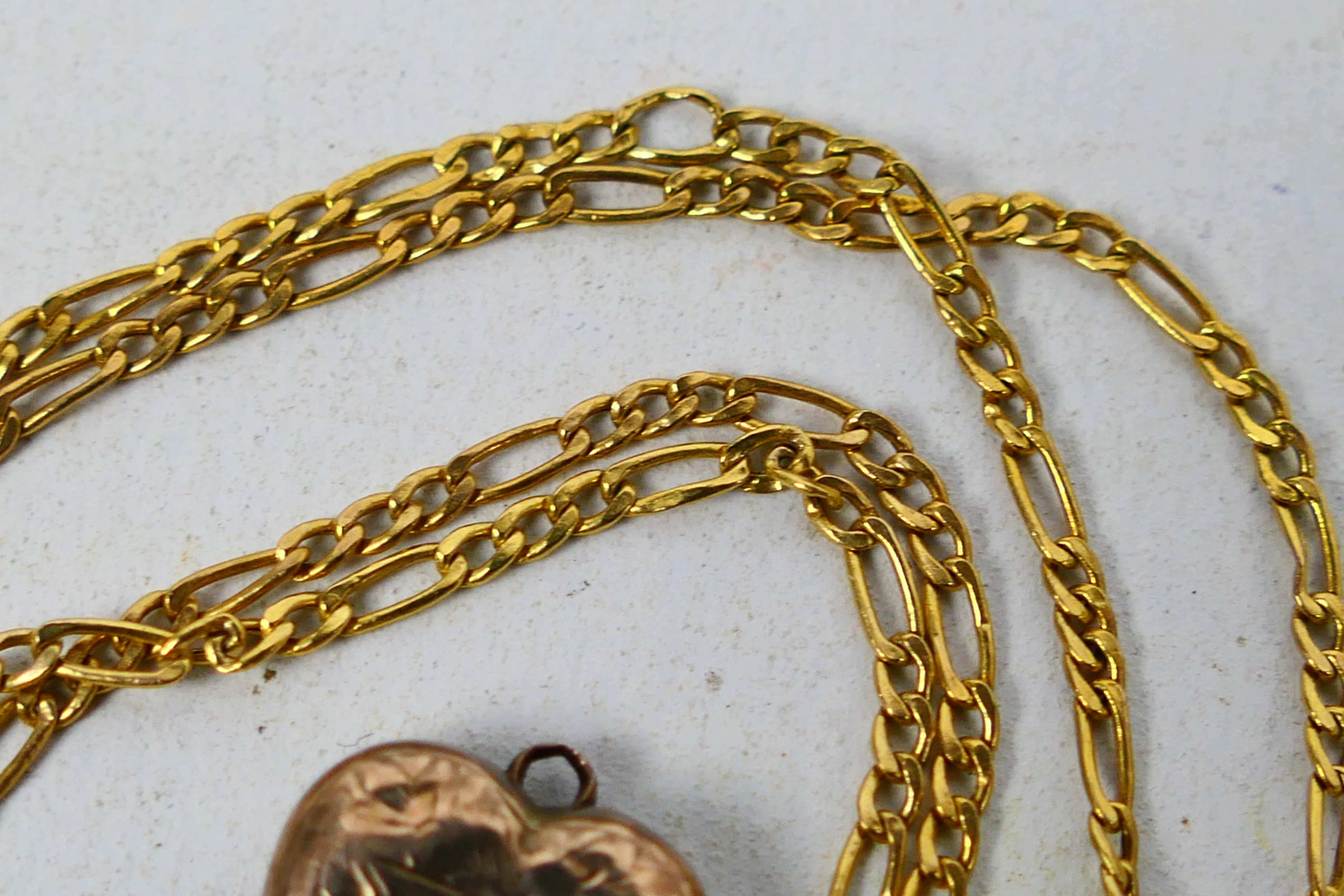 Scrap Gold - A 9ct yellow gold necklace and a rose metal heart shaped locket, 1.9 grams all in. - Image 3 of 3