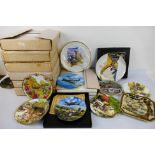 A quantity of collector plates to include African wildlife, aviation and other, part boxed.