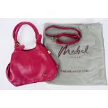 Mabel London - A Mabel London handbag in a shade of red. With two carry handles and shoulder strap.