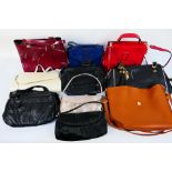 A job lot of unmarked handbags to includ
