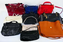 A job lot of unmarked handbags to includ