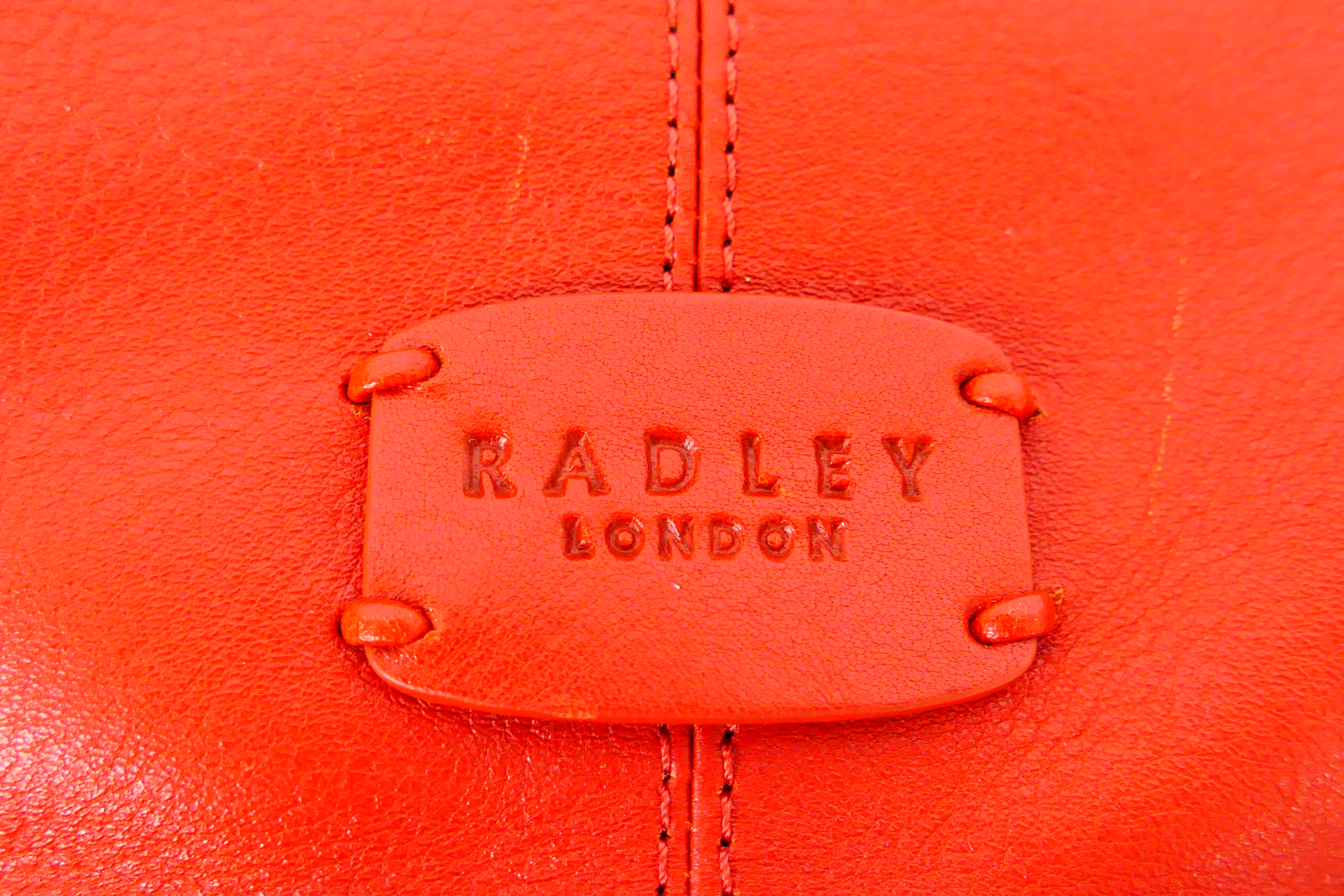 Radley - A limited edition Radley London orange leather handbag - Handbag has one interior zip - Image 3 of 7