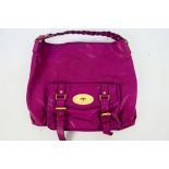 Mulberry - A dark pink Mulberry leather handbag - Handbag has one interior zip pocket, one pouch,