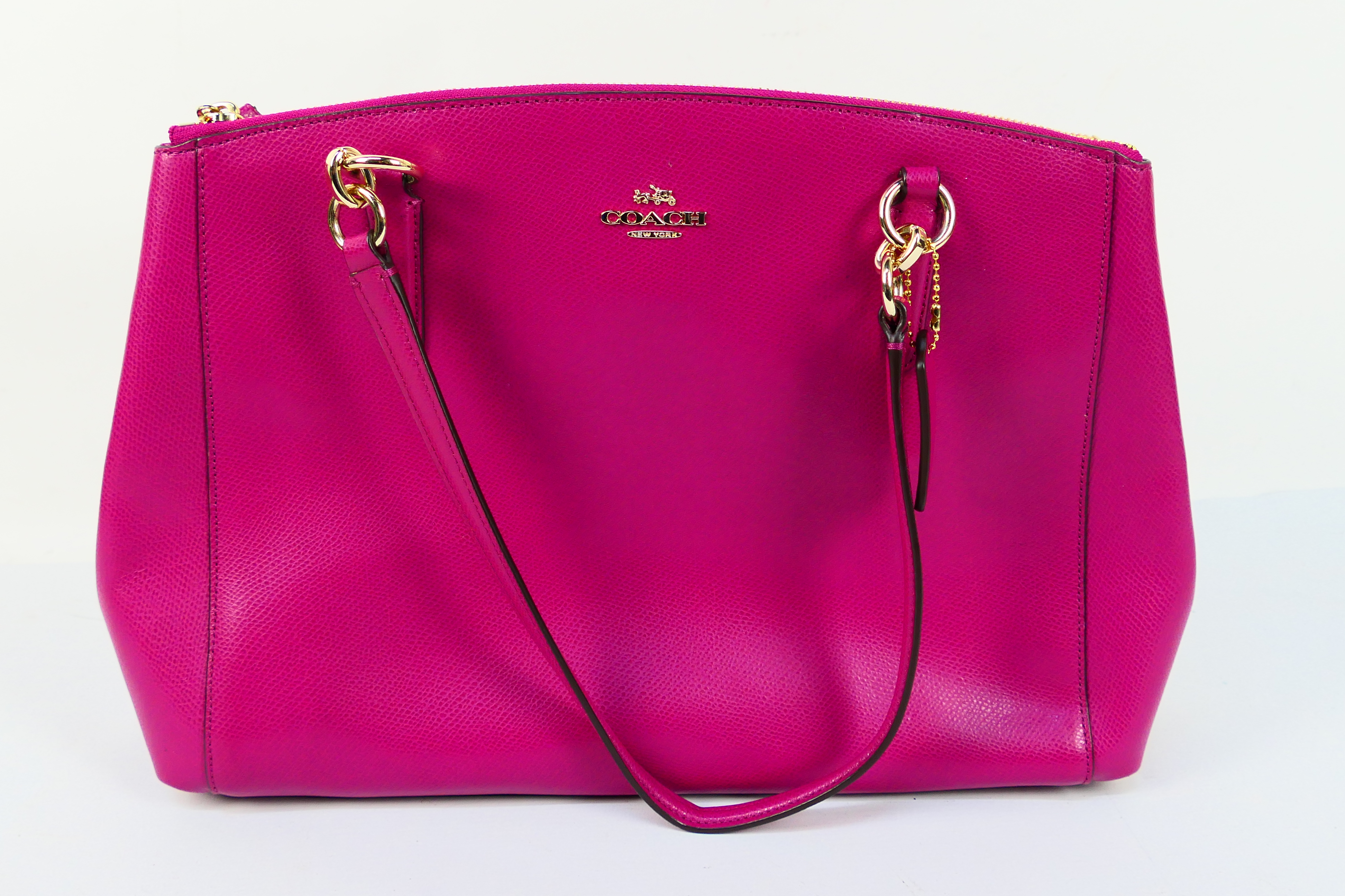 Coach New York - a Cerise Pink Coach handbag, labelled with makers mark,