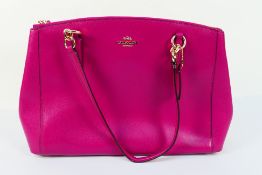 Coach New York - a Cerise Pink Coach handbag, labelled with makers mark,