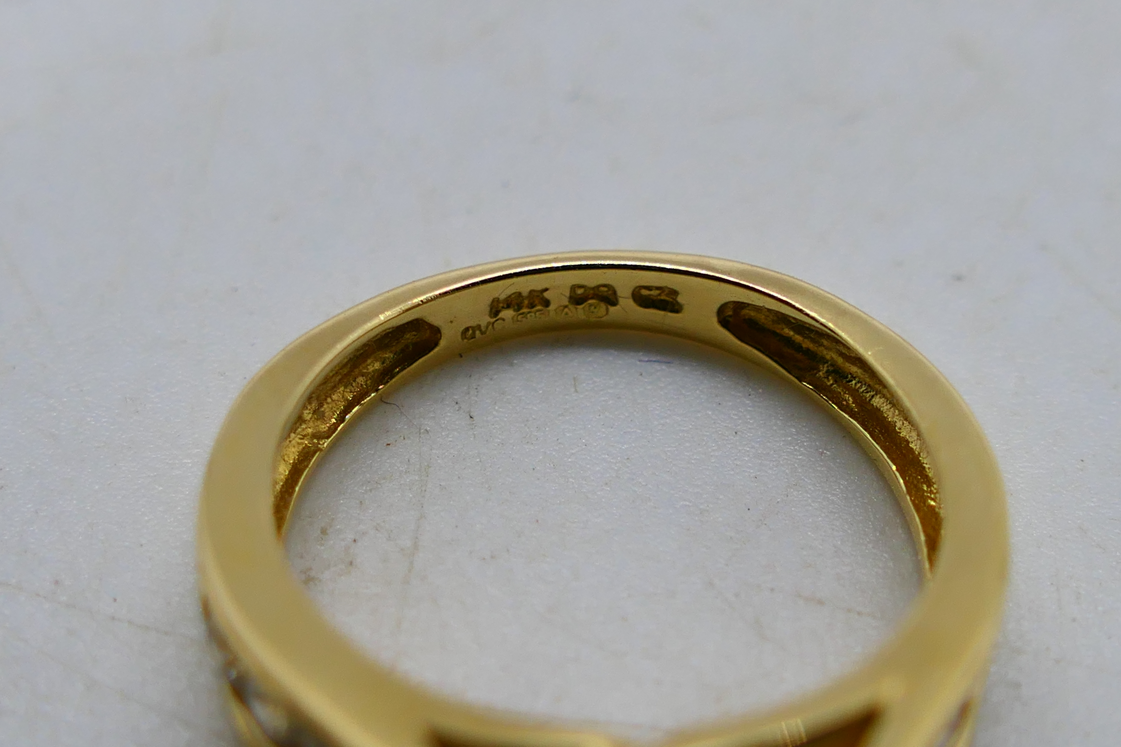 A 14ct yellow gold CZ set ring, size H+½, 3.5 grams all in. - Image 5 of 6