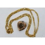 Scrap Gold - A 9ct yellow gold necklace and a rose metal heart shaped locket, 1.9 grams all in.