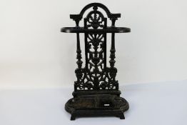 A small cast iron stick stand, 50 cm (h).