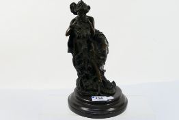 An Art Nouveau style bronze after Claude Mirval depicting a young lady with a mythical beast on