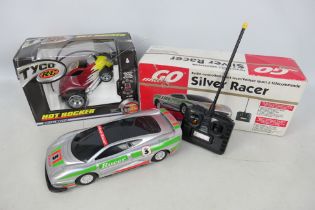 Tyco - Go - 2 x boxed radio control models, a Jaguar XJ220 Silver Racer and a Hot Rocker stunt car.