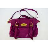 Mulberry - A raspberry Mulberry leather handbag - Handbag has one interior zip pocket and one pouch.