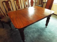 A 19th century mahogany dining table with three removable panels,