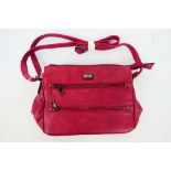 Lulu - A dark red Lulu leather handbag with shoulder strap - Handbag has four inner pouches,