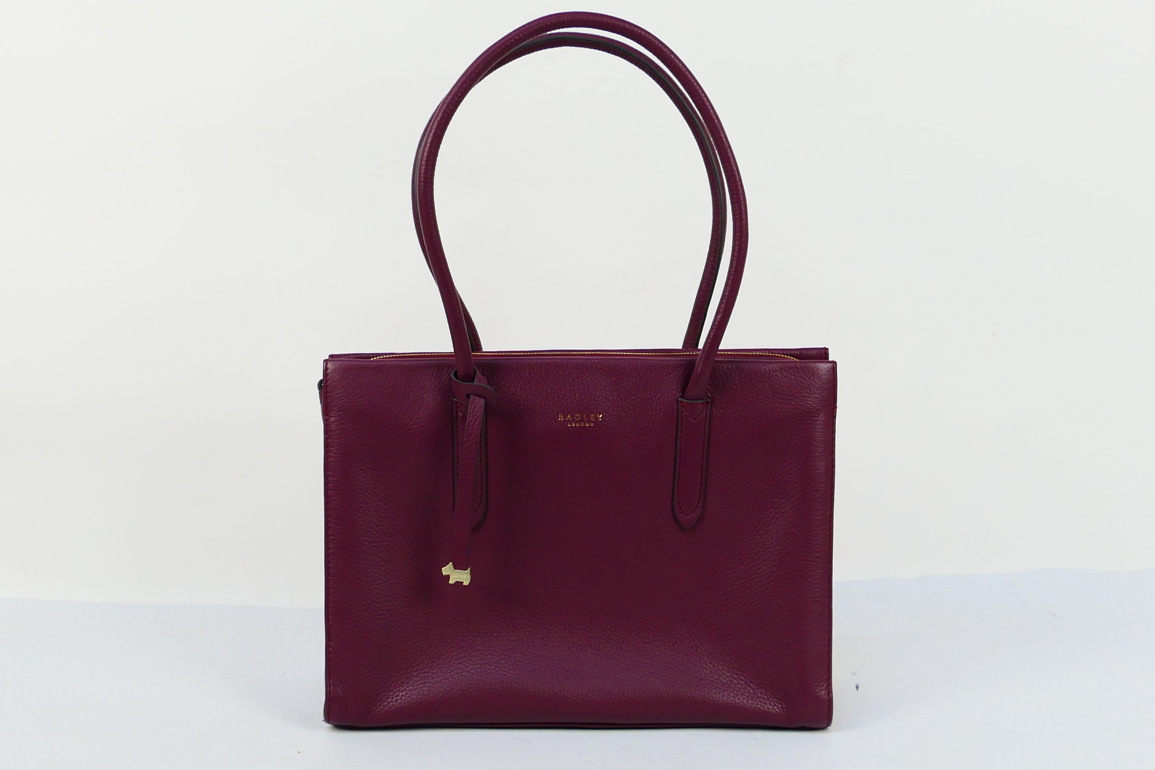 Radley - A purple Radley London leather handbag - Handbag has one interior zip pocket and two