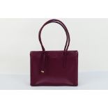 Radley - A purple Radley London leather handbag - Handbag has one interior zip pocket and two