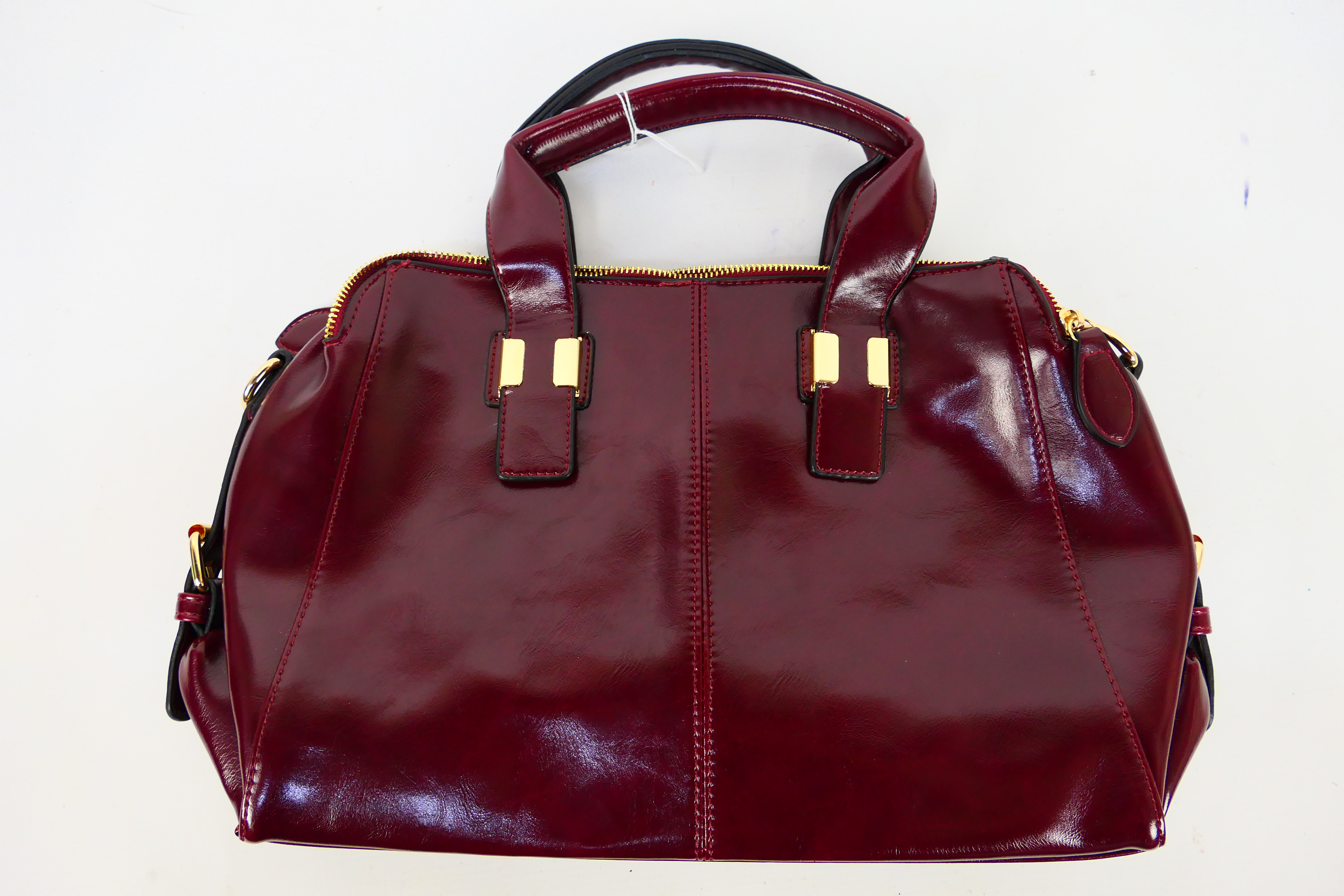 Vaschysac - A Vaschysac cherry red leather handbag with shoulder strap - Handbag has two inner zip