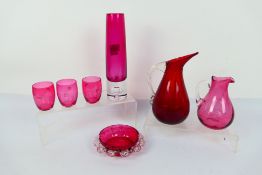 Cranberry Glass - a cranberry art glass vases 24 cm (h) the other 23 cm (w),