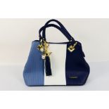 Pomelo Best - A Pomelo Best handbag in tones of blue and white.