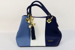 Pomelo Best - A Pomelo Best handbag in tones of blue and white.