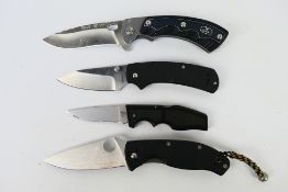 Four folding knives to include Spyderco, Buck and other.