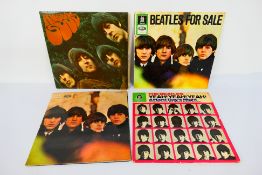The Beatles - 12" Records. Four Beatles records appearing in Fair condition.