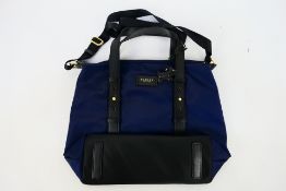 Radley - A dark blue Radley London handbag - Handbag has one interior zip pocket and two pouch