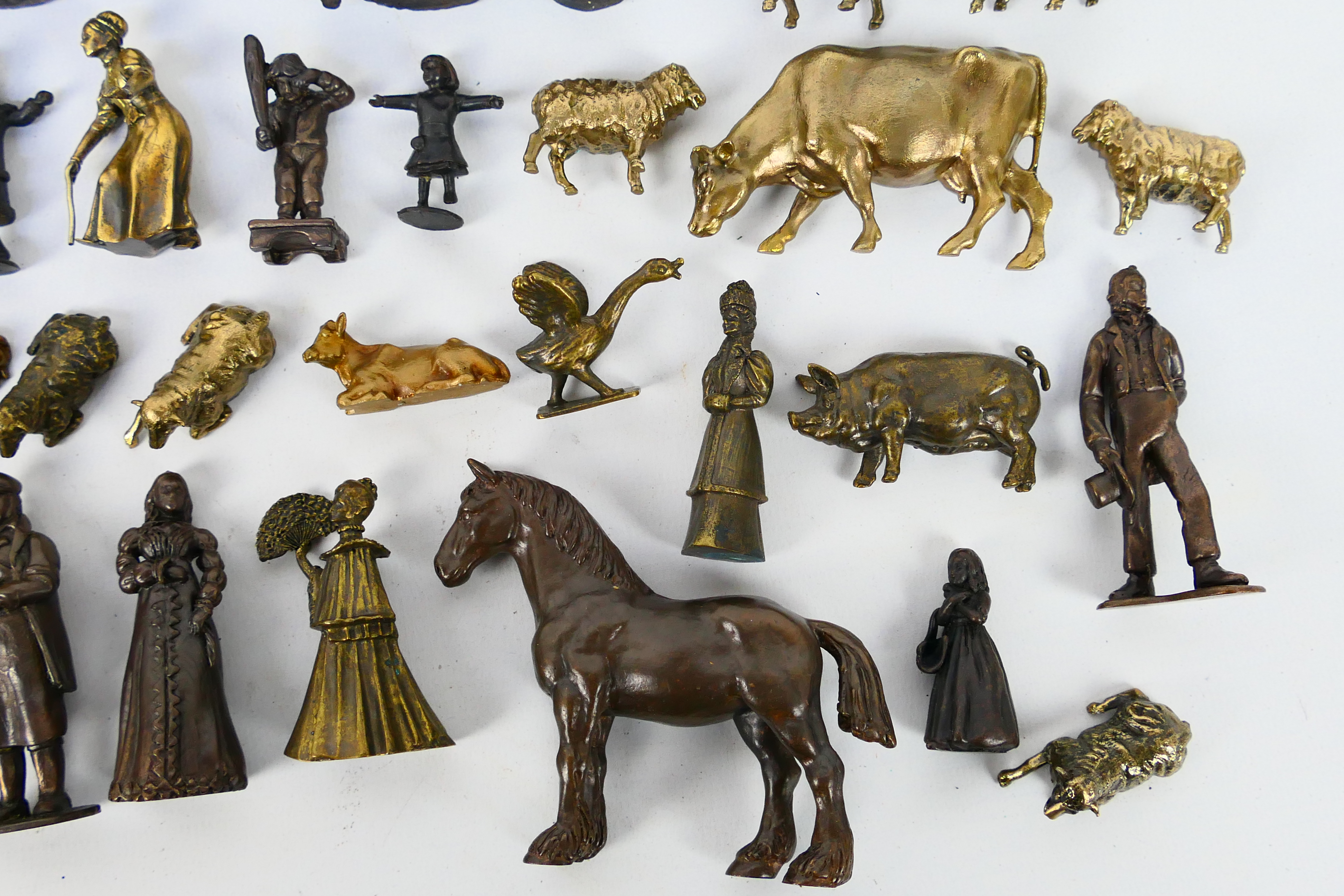 A large collection of bronze figures to include Victorian style, servants, children, - Image 6 of 7