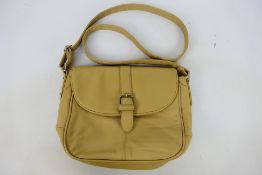 It - A cream It leather shoulder bag - Shoulder bag has two interior zip pockets and two pouches.