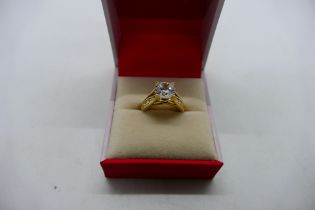 A 14ct yellow gold CZ set ring, size H+½, 3.5 grams all in.