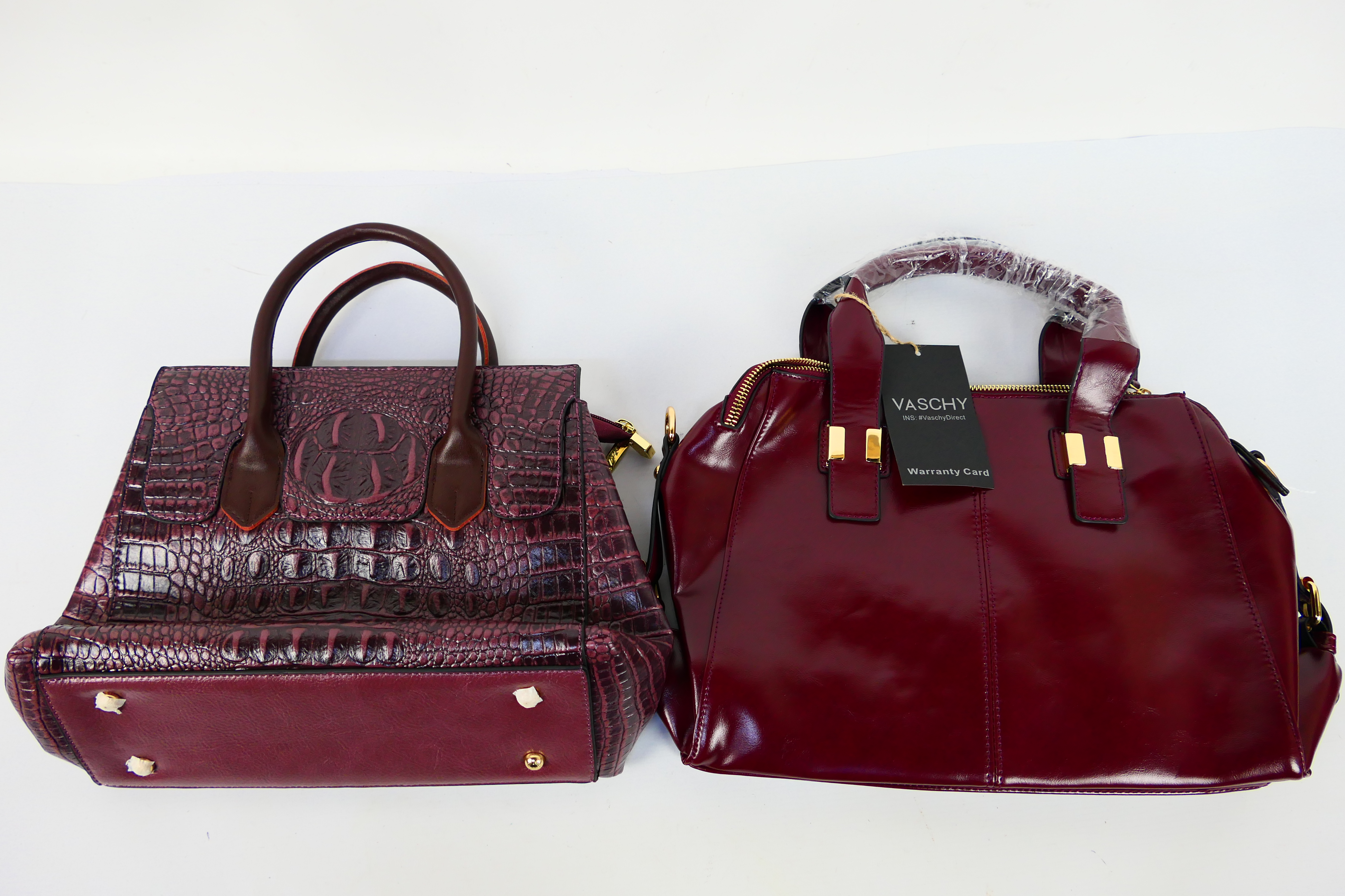 Vaschy - Lirenniao - a maroon Vaschy handbag with tags and shoulder strap,