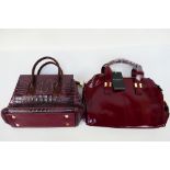 Vaschy - Lirenniao - a maroon Vaschy handbag with tags and shoulder strap,