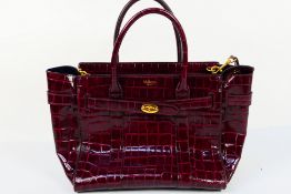 Mulberry - A burgundy Mulberry handbag with shoulder strap - Handbag has one inside pouch.