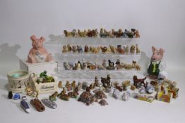 A quantity of Wade Whimsies and similar figures and two Wade Natwest money banks,