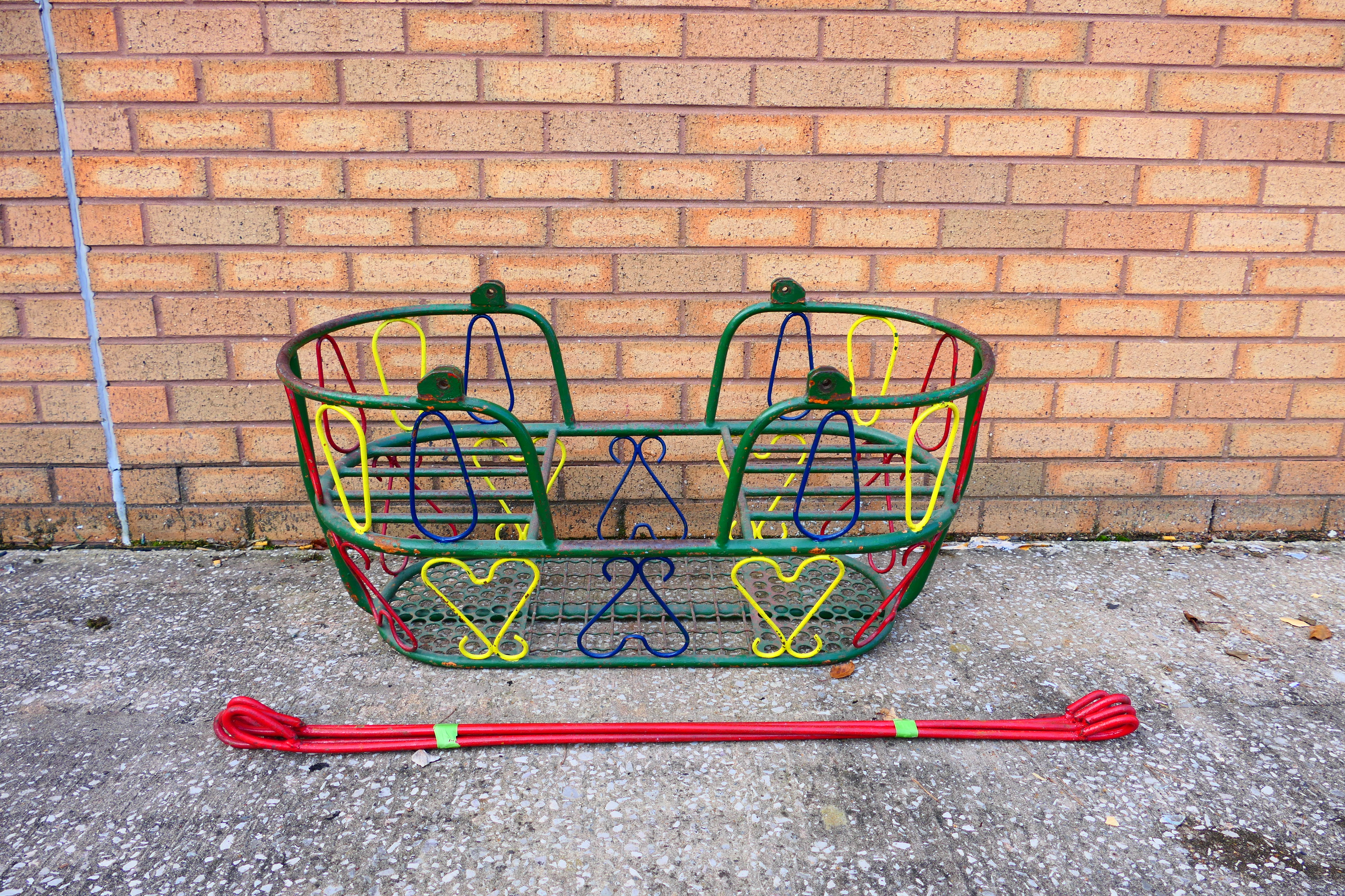 A vintage face to face, children's garden swing, polychrome decoration,