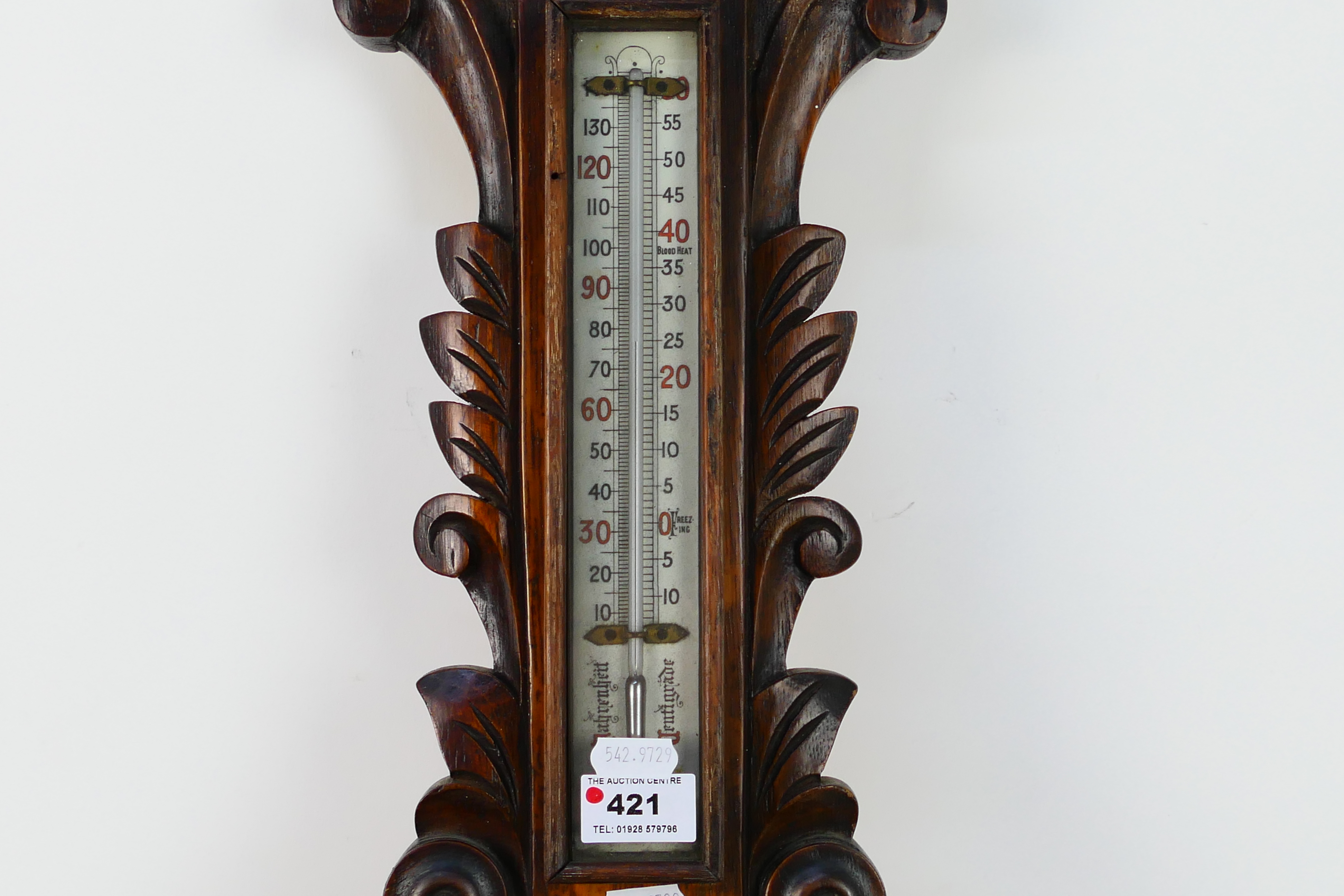 An oak cased aneroid barometer with carved decoration, marked to the dial Eustance & Co Warrington, - Image 2 of 5