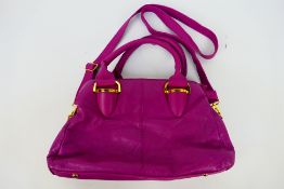 Domo - A pink Domo leather handbag - Handbag has four interior zip pockets and two pouches.